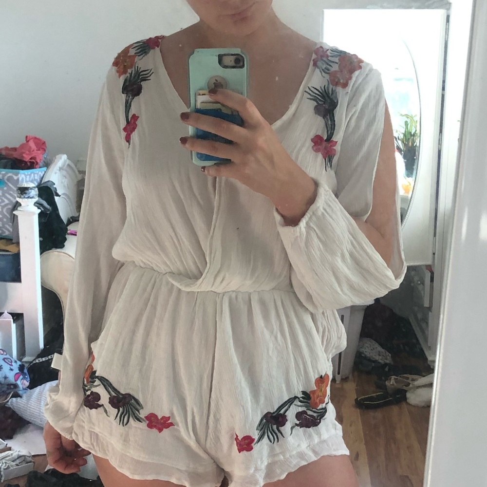 White a romper with flower accents